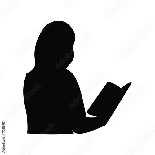 Silhouette of a woman engrossed in reading a book with great interest