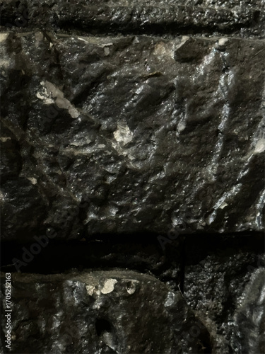 Dark stone wall texture background with rough grunge surface
