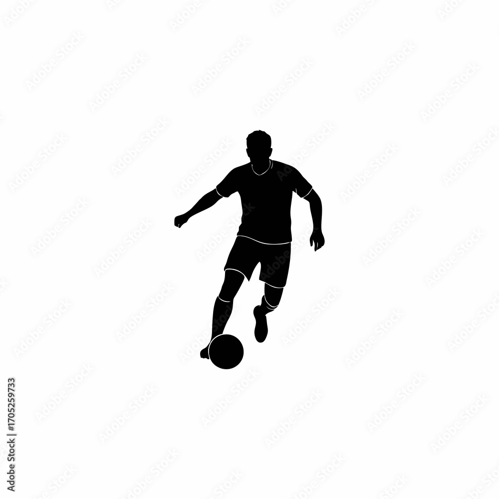 Fototapeta premium The silhouette of a soccer player dribbling the ball