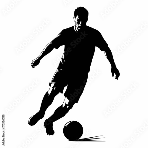 The silhouette of a soccer player dribbling the ball