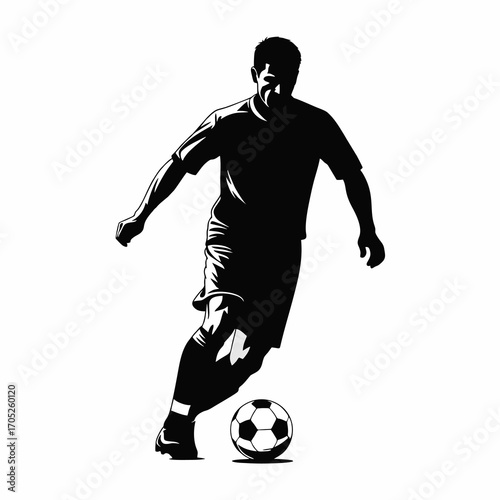 The silhouette of a soccer player dribbling the ball