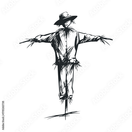 A scarecrow with a hat and outstretched arms.