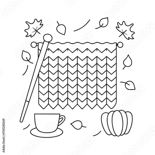Autumn knitting scene with falling leaves a cup of tea and a pumpkin yarn needles