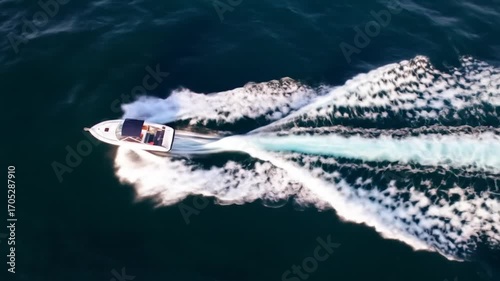 Wallpaper Mural Top-down view of a speeding boat leaving white wake on dark ocean waters Torontodigital.ca