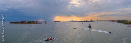Venice skyline from Venetian Lagoon at dusk.