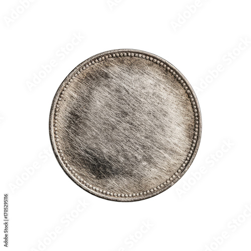 Close-up of a weathered, round coin