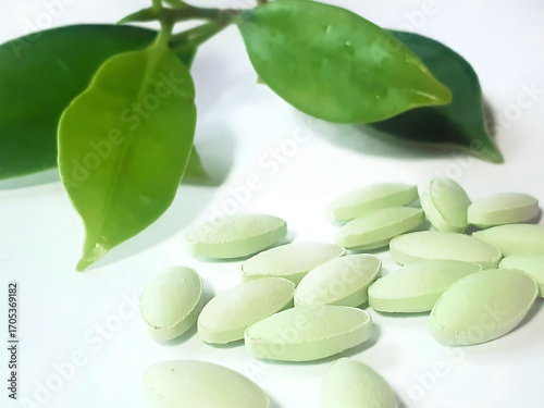 Wallpaper Mural Green Dietary Supplements and Natural Leaves on White Background Torontodigital.ca