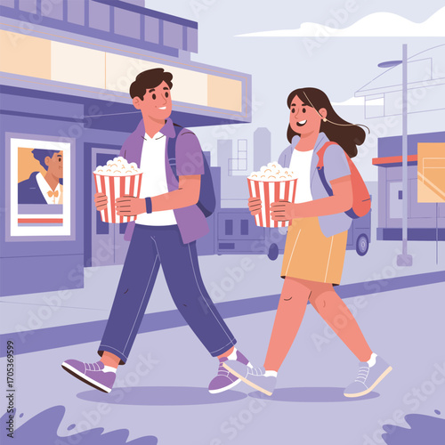 Young couple walking with popcorn outside a cinema building movie theater