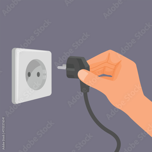 Hand inserting an electrical plug into a wall socket 