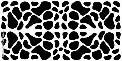 Abstract black and white organic shapes pattern reminiscent of cowhide or dalmatian spots