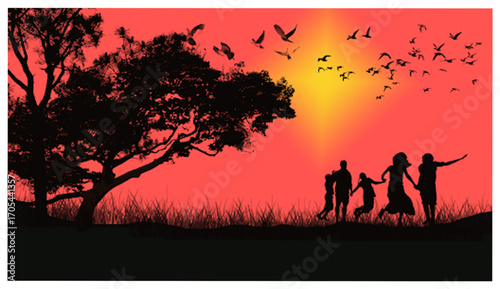 Happy family silhouette walking together on a green meadow at sunset