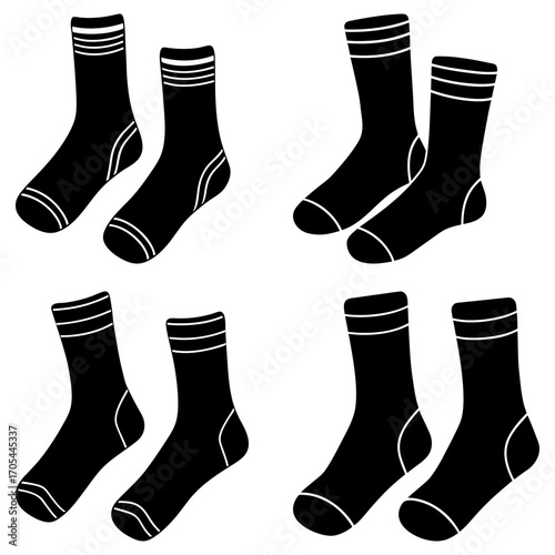 Four pairs of black socks with white stripes are arranged on a white background in the image shown
