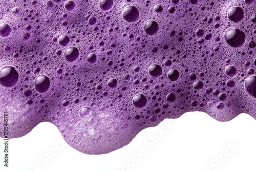 Close-up of vibrant purple soap suds.  Bubbles and foam cascade gently against a white background