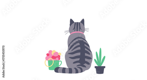 A tabby cat seen from behind with plants and flowers.