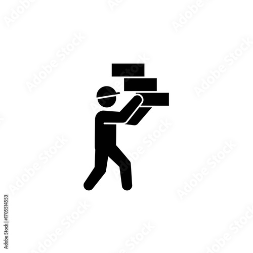 Construction worker carrying a stack of bricks, representing labor and building materials for industry