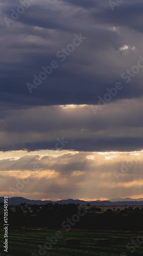 Vertical Video Storm Clouds and Sun Rays over Rural Landscape Timelapse