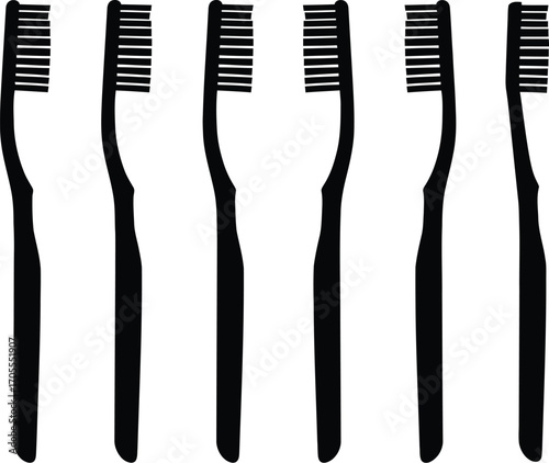 Set of six black toothbrushes lined up for oral hygiene routine