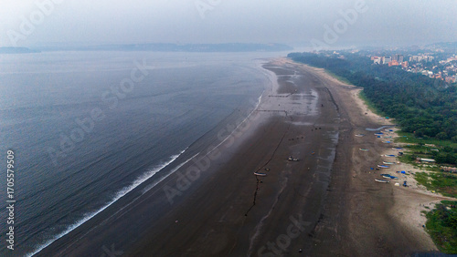 Canvas Print Aerial shot of Miramar Beach Goa from Dona Paula side, showcasing coastline with boats and people, Panjim city on right and vast ocean on left