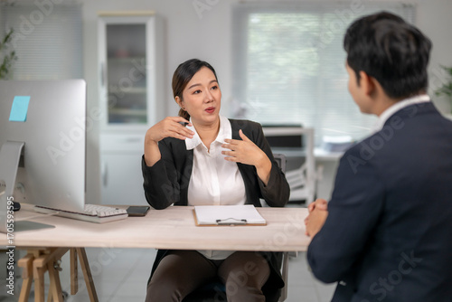 Businesswoman interviewing applicant in modern office setting