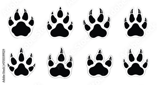 Collection of eight distinct animal paw prints in black and white.