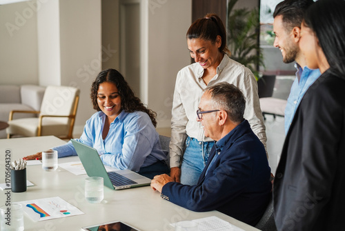Multigenerational business people sharing ideas inside company office - Multiracial colleagues discussing new financial project - Brainstorming and corporate concept - Main focus on center woman face