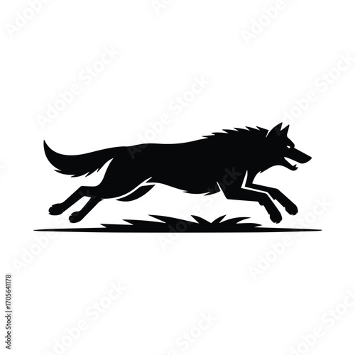 Silhouette of a majestic wolf running gracefully across the grassy plains with power and agility
