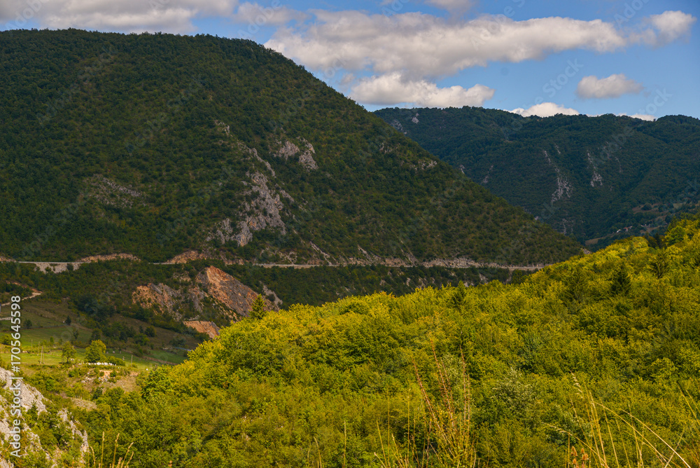 Naklejka premium landscape with mountains and clouds
