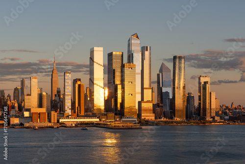 Photography Hudson Yards skyscrapers in Manhattan at sunset with skyline reflecting golden light