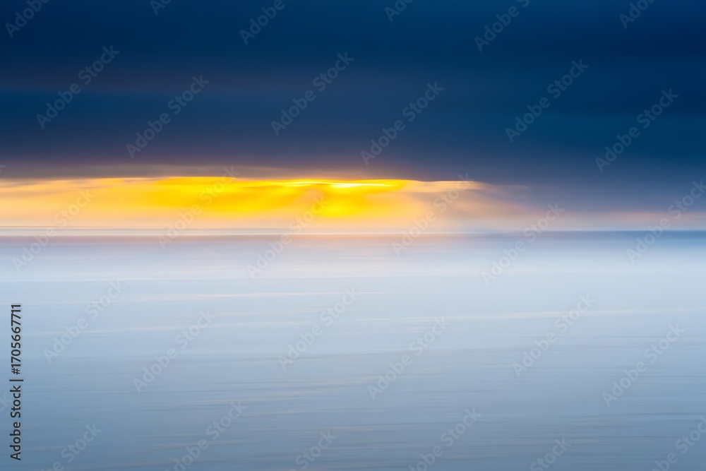 Fototapeta premium Dramatic sunrise sky over calm ocean waters for tranquil mood