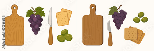 Assortment of wooden cutting boards, fresh grapes, savory crackers, green olives, and a cheese knife for a delicious appetizer spread