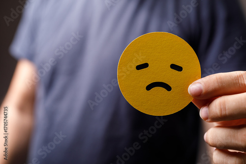 A person holds up a gold sa...