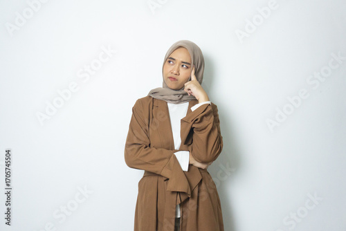 young Indonesian jilbab girl thinking worried Gesture isolated white