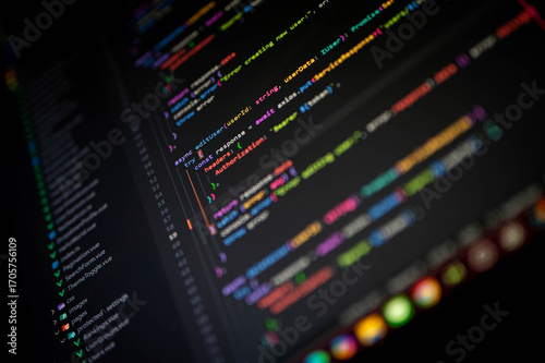 Photos Programming code on a dark-themed interface with vibrant syntax colors, illustrating software development, modern coding workflow, and front-end or back-end engineering in a digital workspace