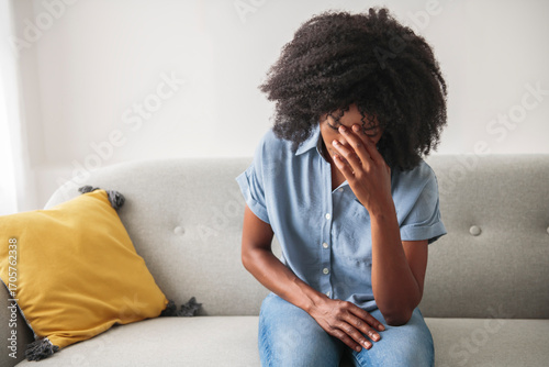 Black woman feeling regret emotion, depressed person.