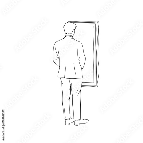 A man in a suit stands with his back to the viewer looking at a framed picture hanging on the wall art