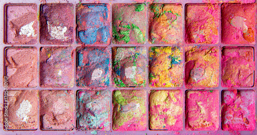 Beautiful mess. Worn, torn beautifully messed up colorful makeup eye shadow palette. Vibrant colors.