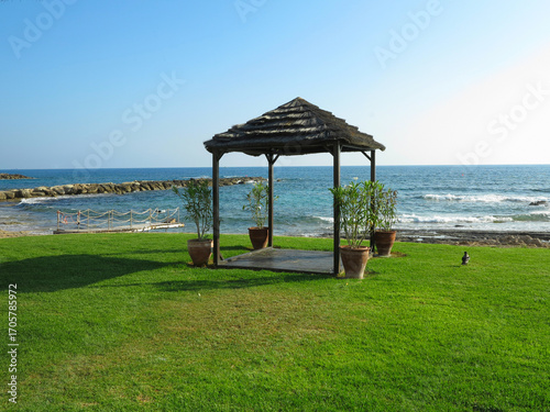 Beautiful landskape, palm trees and sun loungers at luxury resort