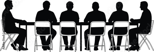 Silhouettes of Men Sitting Around a Table in a Meeting group