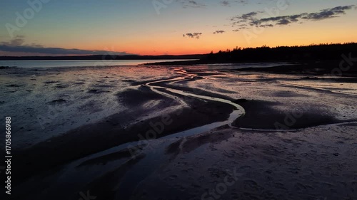 Drone footage of the mudflats on the coast of Ministers Island in New Brunswick, Canada at sunset