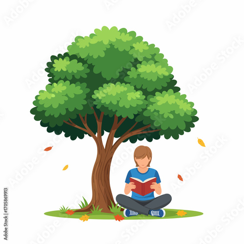 A young person sits cross-legged under a large green tree, engrossed in reading a book on a grassy patch with fallen leaves.