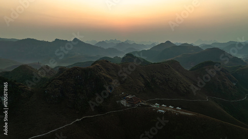 Fotografija Dawn on the high mountain peaks of Ha Lang area, with pack horses and people going to work