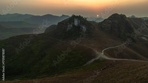 Fotografija Dawn on the high mountain peaks of Ha Lang area, with pack horses and people going to work