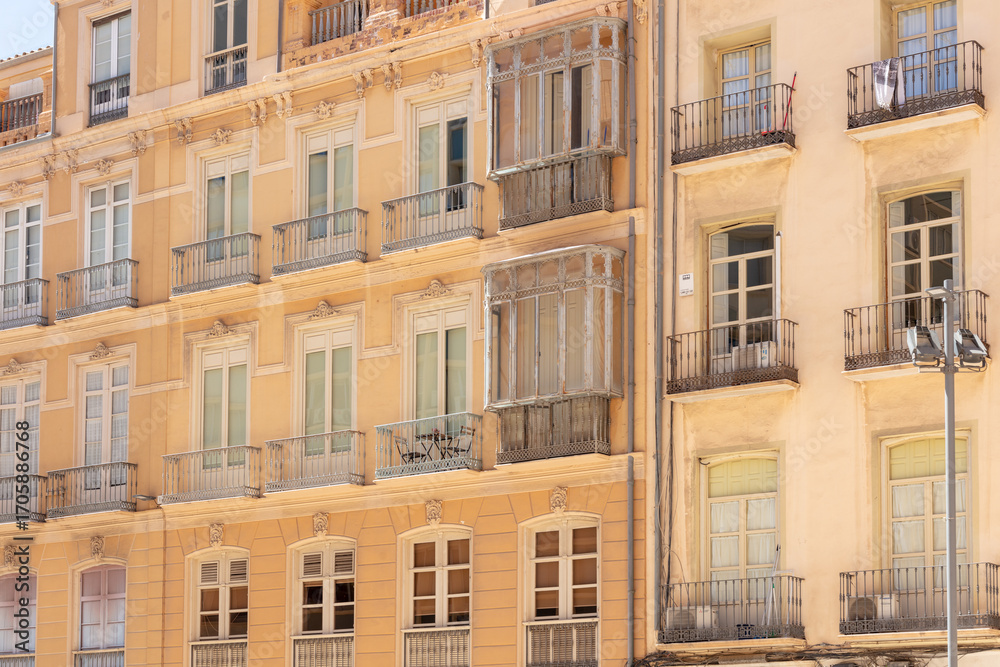Fototapeta premium Malaga, Andalusia, Spain. 4 September 2025. Historic residential buildings