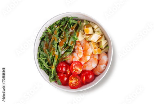 Delicious poke bowl with tender shrimp, fresh avocado cubes, cherry tomatoes, crisp greens and flavorful dressing, served in a paper bowl, top view