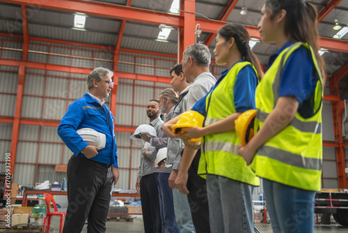 Tablou pe pânză Team safety briefing warehouse training session industrial environment group per