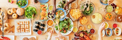Quadro su tela A diverse group enjoys a colorful feast