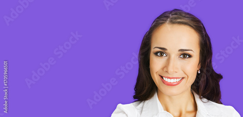 Portrait image - happy smile corporate formal businesswoman, office person. Confident brunette dark hair woman wear white shirt, isolated violet purple background. Business concept. Free text space