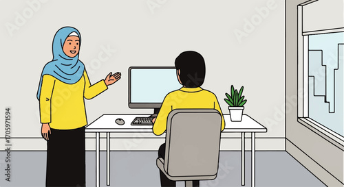 Woman in hijab talking to man at computer in office.