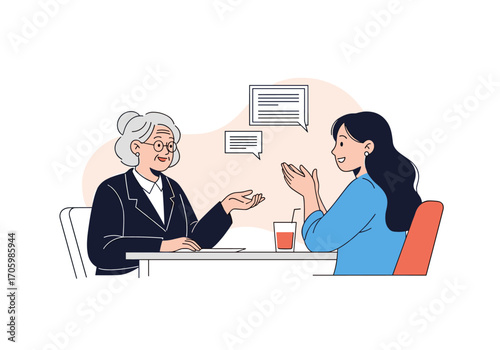 Two women in a meeting discussing business ideas.