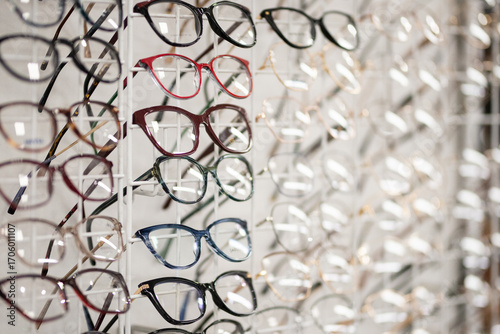Many different stylish glasses on light grey background, flat lay